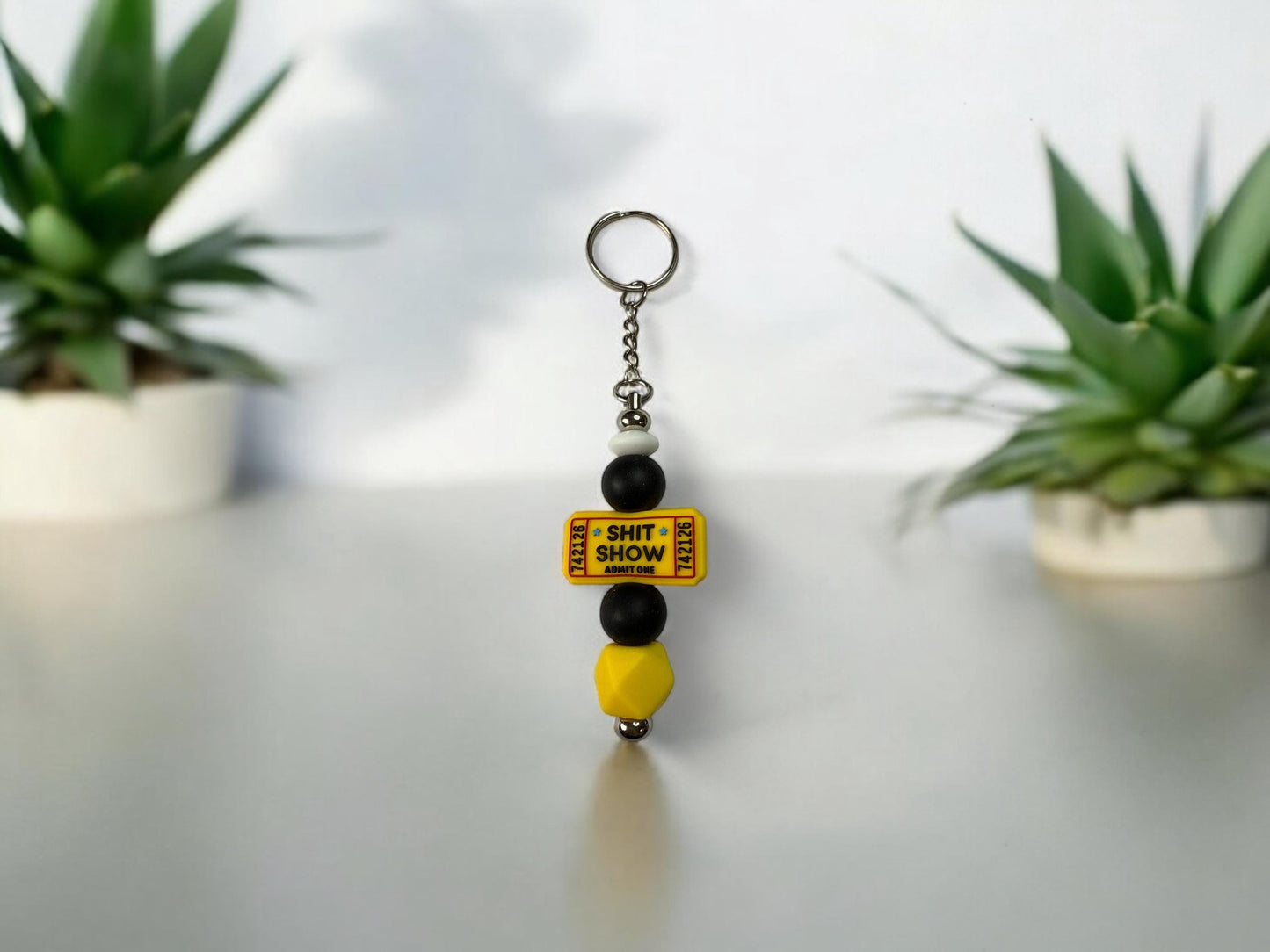 SH*T SHOW Admissions Tickets on Silver Keychain