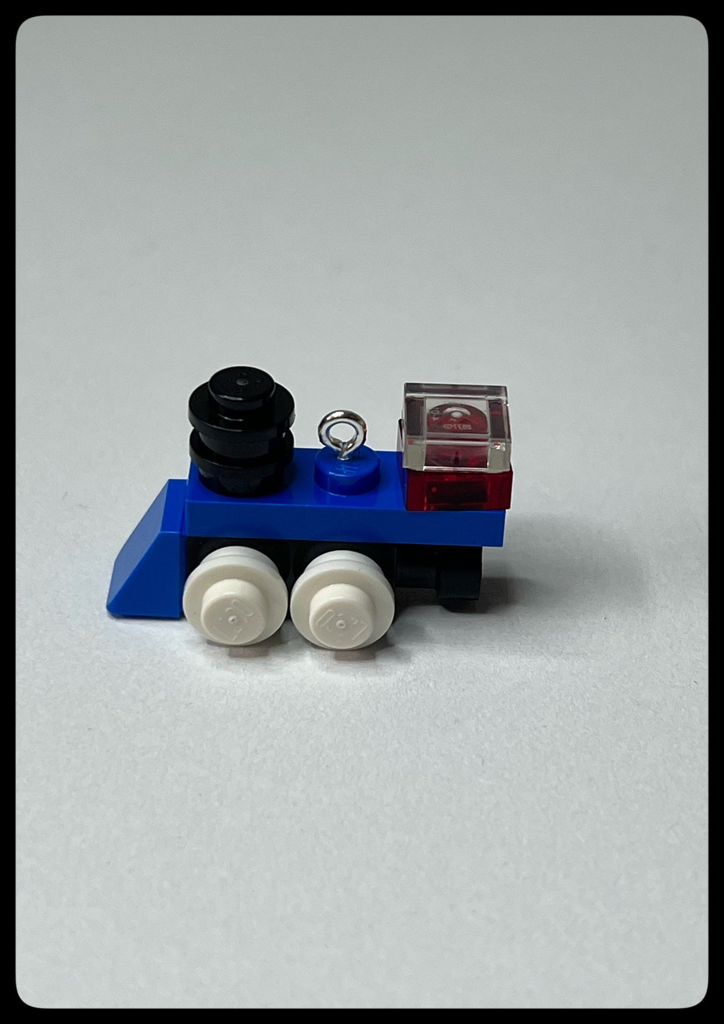 Small toy train engine on a white background